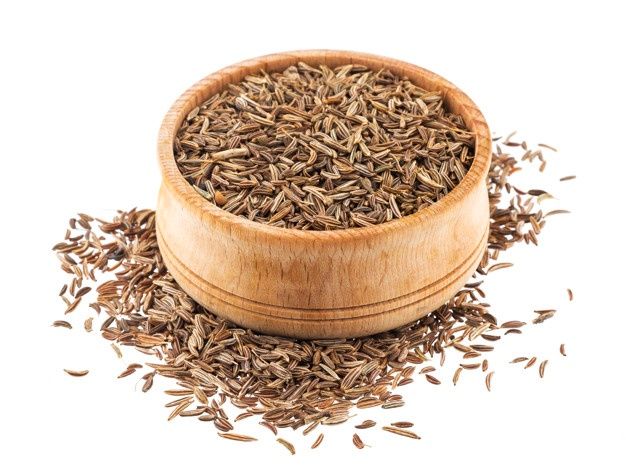 Caraway seeds in wooden bowl isolated on white background _ Premium Photo